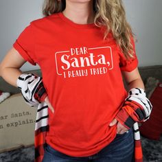 This Funny Christmas short Sleeve tee fits like a well-loved favorite. A great gift for anyone who has a quirky sense of humor or even yourself. Ideal for any situation, a unisex jersey made of soft cotton with a ribbed knit collar will retain its shape even after washing. The shoulders are tapered for a better fit, no itchy seams and has a tear-away label to minimize skin irritation. Easy to layer, breathable, perfect for active and leisure wear. All T-shirts are made to order. They will ship w Funny Print T-shirt For Christmas Gift, Funny Holiday T-shirt With Graphic Print, Fun Red T-shirt, Red Novelty Crew Neck T-shirt, Funny Red Crew Neck Top, Red Novelty T-shirt With Crew Neck, Red Fun T-shirt With Funny Print, Fun Red T-shirt With Funny Print, Red T-shirt With Funny Print