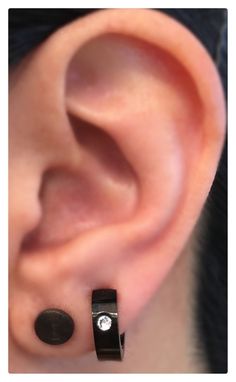 an ear with two black and white dots on it