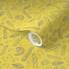 a yellow wallpaper with blue and white doodles on the side, along with a roll of tape