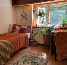 a bed room with a neatly made bed next to a window and a rug on the floor