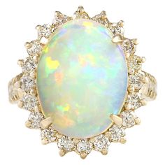 6.48 Carat Natural Opal 14 Karat Yellow Gold Diamond Ring Stamped: 14K Yellow Gold Total Ring Weight: 7.9 Grams Total Natural Opal Weight is 5.13 Carat (Measures: 16.00x12.00 mm) Color: Multicolor Total Natural Diamond Weight is 1.35 Carat Color: F-G, Clarity: VS2-SI1 Face Measures: 20.65x18.00 mm Sku: [704062W] Luxury Diamond Rings, Opal Diamond Ring, Yellow Gold Diamond Ring, Modern Engagement Rings, Colorless Diamond, Luxury Diamonds, Diamond Cocktail Rings, Gold Diamond Ring, La Face