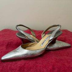 Description Metallic Silver Leather Manolo Blahnik Pointed-Toe Slingback Pumps With Tonal Stitching Throughout And Covered Heels. Includes Dust Bag. Fit: This Style Typically Runs Narrow And A Half Size Small. Heels: 3.25" Details:Faint Wear Throughout Leather. Size: 39 But Fits More Like An 8 Manolo Blahnik Carolyne, Small Heels, Shoes Manolo Blahnik, Metallic Pumps, Blahnik Shoes, Manolo Blahnik Shoes, Slingback Pump, Manolo Blahnik, Metallic Silver