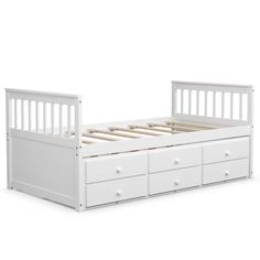 a white bed with drawers underneath it and an open bottom drawer on the bottom side