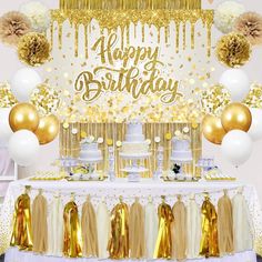 a birthday party with gold and white decorations