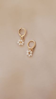 These are THE CUTEST hoop floral earrings! I personally have pretty sensitive ears and so I made sure to get good quality earrings! I've had mine in for quite a while now and I haven't taken them off during showers or while I'm sleeping. They have not rusted or caused any irritation! They are 18k plated and are super light weight. Completely hand made using Czech glass beads.  NOTE: Etsy will only allow for 2 variations. Currently I have 1 for metal and 1 for the primary color, please message me your secondary color (the center color bead) Everyday Flower Charm Hoop Earrings, Spring Dangle Hoop Earrings For Pierced Ears, Spring Dangle Hoop Earrings, Adjustable Flower Hoop Earrings For Everyday, Dainty Hoop Earrings With Flower Charm, Spring Small Hoop Earrings For Pierced Ears, Trendy Flower Hoop Earrings, Spring Small Hoop Earrings, White Hoop Earrings With Flower Charm