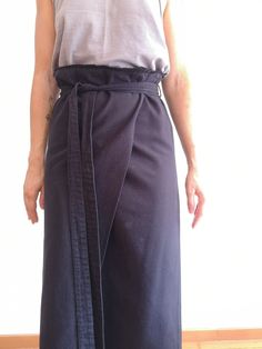 Invisible zip on the back. With small fringes details on the bottom. Size Small. Measurements Front waist is 40 cm Lenght is 80 cm Fitted Cotton Skirt With Belt, Asymmetrical Cotton Wrap Skirt For Workwear, Cotton Belted Skirt, Belted Long Wrap Skirt, Cotton Belted Relaxed Skirt, Long Cotton Skirt With Tie Waist, Cotton Long Skirt With Tie Waist, Chic Cotton Skirt With Tie Waist, Cotton Wrap Skirt For Work