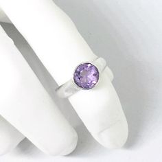 "A sterling silver ring with a gorgeous bright purple faceted amethyst. Available in US ring sizes 6-8. The natural amethyst gemstone is 8mm (3/8\" inch). Please message me if you would like a size not listed. Custom orders are welcome!" Purple Amethyst Solitaire Birthstone Ring, Round Cut Solitaire Amethyst Birthstone Ring, Amethyst Solitaire Birthstone Ring, Round Cut, Amethyst Solitaire Round-cut Ring, Heart-shaped Amethyst Birthstone Ring In Sterling Silver, Dinosaur Ring, February Birthstone Ring, Purple Ring, Ring Purple