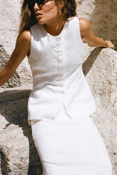 Softly tailored in 100% linen, the Domenico Vest Top in White is a feminine, vintage-inspired silhouette featuring a high round neckline, button front detail and an adjustable back strap to cinch at desired. Finished with a side pocket detail and fully lined for extra coverage. Linen Vest, Maxi Dress Sale, Dreamy Dress, Faithfull The Brand, Vest White, Vest Outfits, Linen Women, Vest Top, Pocket Detail