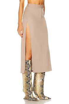 Find ATTICO Straight Midi Skirt on Editorialist. THE ATTICO Straight Midi Skirt in Beige Self: 100% virgin wool Lining: 53% acetate 47% viscose. Made in Italy. Dry clean only. Fully lined. Zip fly with hook and bar closure. ATTF-WQ76. 241WCS186 - W046 - 198. About the designer: Attico represents a time where glamour ruled and decadence was a way of life. Derived from the Italian word for penthouse, Attico is reviving the way a woman gets dressed. Launched in 2016, Italian designers Giorgia Tordi Beige Fitted Asymmetrical Maxi Skirt, Fitted Beige Asymmetrical Maxi Skirt, Fall Fitted Beige Maxi Skirt, Fitted Beige Maxi Skirt For Fall, Chic Tailored Midi Skirt, Tailored Chic Wool Skirt, Tailored Wool Skirt Chic Style, Chic Tailored Wool Skirt, Spring Wool Midi Skirt