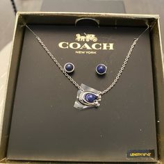 New In Box, Authentic Coach Necklace And Earrings. Silver Coach Jewelry For Gift, Coach Silver Jewelry For Gift, Coach Sterling Silver Jewelry, Coach Silver Jewelry For Formal Occasion, Coach Elegant Sterling Silver Jewelry, Elegant Coach Sterling Silver Jewelry, Elegant Silver Coach Jewelry, Blue Metal Jewelry Sets As A Gift, Formal Silver Coach Jewelry