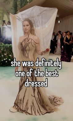 a woman in a dress with the words she was definitely one of the best dressed