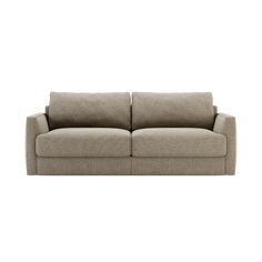 a beige couch sitting on top of a white wall