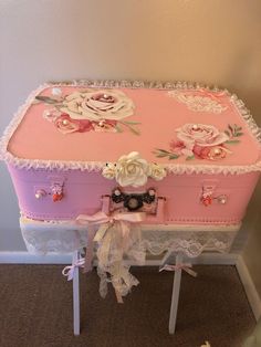 a pink and white trunk with flowers on it