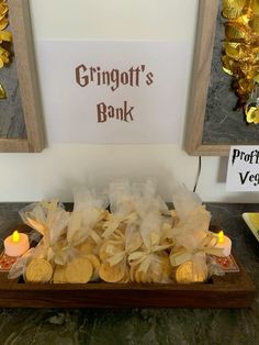 a tray filled with lots of cookies next to a sign that says grinott's book