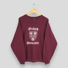 Vintage 90s Oxford University Red Sweatshirt Large Oxford University Printed Logo Pullover Oxford Cambridge Sweater Oxford Crewneck Size L Size On Tag :- Size L Manual Measurement :- WIDTH (armpit to armpit) :- 23.5" inches LENGTH (shoulder to end of garment) :- 27.5" inches WEIGH :- 0.42 kg Condition :- Good Condition. No holes and no stains. - Colors Might Be Different Due To Lighting. - All items are VINTAGE which show some signs of wear and tear. FEDEX EXPRESS = 3-6 business day arrived Plea Oxford University Sweatshirt, Campus Fashion, Campus Style, Red Sweatshirt, University Sweatshirts, Oxford University, Fedex Express, Fashion Fall, Print Logo