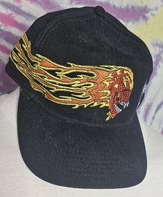 VINTAGE Metallica Flaming Skull Baseball Cap BIODOMES  Biodomes Tag One Size Fits All Adjustable Strap on back Own an Authentic piece of Metallica Metal Music History. Featuring Flaming Skull Logo on Front and right side Metallica Letter logo on Left Side  Excellent condition  All photos are of actual item for sale. Ships FREE with USPS First Class Mail with Tracking to Continental U.S  International shipping rates apply Vintage Black Distressed Baseball Cap, Vintage Visor Hat For Streetwear, Adjustable Skull Hat For Streetwear, Vintage Distressed Hat For Streetwear, Vintage Black Distressed Hat, Vintage Distressed Black Hat, Vintage Baseball Cap For Festivals, Vintage Festival Baseball Cap, Vintage Cap For Festival