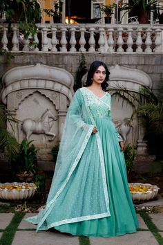 Beautiful ombre angrakha dress with pleated flare at the waist. The yoke is printed and intricately embroidered. It is paired with a net dupatta having buti and border.
– Non padded
– hand embriodered yoke
– Fully lined
– Zipper and hook opening at the back Traditional Turquoise Dress For Festive Occasions, Traditional Turquoise Dress For Diwali, Designer Turquoise Dress With Zari Work, Turquoise Dress With Zari Work For Designer Wear, Turquoise Zari Work Designer Dress, Turquoise Bollywood Dress With Zari Work, Bollywood Style Turquoise Dress With Zari Work, Traditional Turquoise Dresses For Diwali, Traditional Turquoise Dresses For Festivals