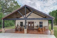 the front and back of a house with a metal roof