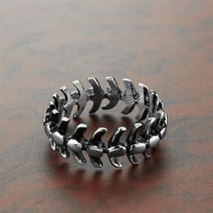 Challenge yourself with the Skeleton Spine Ring! Imbued with a bold personality, this daring piece of jewelry will give your look a daring edge. Take the plunge and show your daring side! BUY TWO & Get 3rd* item Free from our UNISEX Goth Jewelry Collection. *The Lowest Priced Item. Must add 3 items to the cart to see the discount applied at the check out. GENDER: UNISEX 316L Stainless Steel Not allergic, Does not rust, Not deformed Water, Heat, Sweat Resistant Hypoallergenic (No Green Skin) Spine Ring, Skeleton Spine, Steel Dragon, Animal Zodiac, Bold Personality, Dragon Fish, Handmade Skulls, Steel Detail, Biker Rings