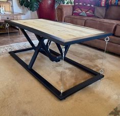 a coffee table sitting on top of a carpeted floor