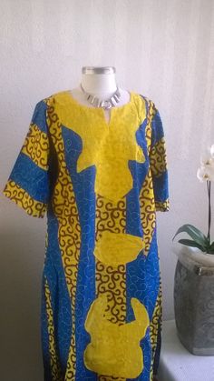 African print dress  Unlined Sleeve: 3/4 elastic 34 cm  Length: 114 cm  from top to hem bust :63cm one size Season: Winter, Spring, Summer, Fall  African print cotton Handmade in the Netherlands. Care Instruction: Machine wash cold water, but hand washes recommended.  Mild Detergent Wash with like colors,  Do not bleach.  Hang to dry. Iron inside out. Yellow Fitted Ankara Fabric Dress, Yellow Cotton Dress With Batik Print, Fitted Yellow Patchwork Dress, Traditional Yellow Dress With Batik Print, Multicolor Cotton Dress With 3/4 Sleeves, Yellow Cotton Tunic Dress, Gown Yellow, African Gowns, Dress Ankara