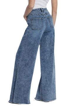 Raw hems refresh the retro style of elongating wide-leg jeans crafted from faded low-stretch denim. 32" inseam; 23" leg opening; 10 1/4" front rise Zip fly with button closure Five-pocket style 67% cotton, 27% REPREVE® recycled polyester, 5% rayon, 1% spandex REPREVE recycled polyester is made from 100% post-consumer recycled plastic bottles Machine wash, tumble dry Imported High Waist Distressed Flare Jeans In Washed Blue, Dark Wash Wide Leg Cargo Jeans, High Waist Distressed Washed Blue Flare Jeans, Trendy Faded Flare Jeans, Trendy Washed Full-length Jeans, Trendy Washed Full-length Flare Jeans, Trendy Washed Full Length Jeans, Trendy Relaxed Fit Faded Flare Jeans, High-rise Denim Blue Flare Jeans With Frayed Hem