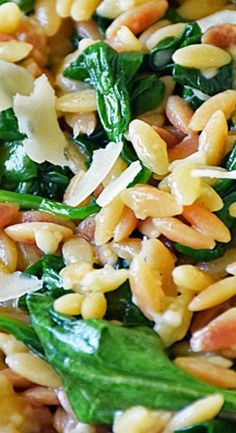 spinach, pine nuts, and other vegetables are mixed together in a salad dish