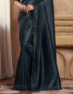 COLOR : Shimmer Peacock Black FABRIC : Saree - Fancy Silk, Blouse - Fancy Silk & Net WORK : Resham Embroidery, Stones, Sequins, Lace BorderOCCASION : Wedding, Engagement, Party Wear, Festival, Sangeet NOTE : The outfit includes blouse and saree only. Petticoat is not included. READY-TO-WEAR : No STITCHING : Available as semi-stitched fabric, can be stitched using standard size option (+$30). Note: There might be a slight color variation due to lighting and flash used during photoshoot. The bright shade seen is the best closer view of fabric's color. Embroidered Georgette Pre-draped Saree For Formal Occasions, Elegant Embroidered Art Silk Pre-draped Saree, Evening Semi-stitched Traditional Wear For Navratri, Formal Festive Pre-draped Saree With Intricate Embroidery, Evening Traditional Wear With Resham Embroidery In Tissue Silk, Traditional Chanderi Evening Set, Traditional Chanderi Sets For Evening, Embellished Art Silk Anarkali Blouse Piece, Embellished Art Silk Saree For Reception