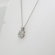 A fine Italian gold & diamond necklace.  In 14k white gold.  Prong set with 7 round brilliant cut diamonds in a stylized floral form.  (Overall ca. 3/4 total carat weight; Color range: G-H; Clarity range: VS-SI)  Accompanied by a GEMLAB (Gemological Appraisal Laboratory) report.  Simply a wonderful diamond pendant for any occasion!  Date: 20th Century  Overall Condition: It is in overall good, as-pictured, used estate condition with some fine & light surface scratches and other signs of expected Exquisite Sterling Silver Necklace With Single Cut Diamonds, Elegant Oval Pendant Diamond Necklace With Single Cut Diamonds, White Gold Oval Pendant Diamond Necklace With Prong Setting, Exquisite White Gold Diamond Necklace With Brilliant Cut, Fine Jewelry Platinum Diamond Necklace With Single Cut Diamonds, Luxury Brilliant Cut Diamond Flower Pendant Necklace, Fine Jewelry Platinum Diamond Necklace, Oval Pendant Diamond Necklace With Prong Setting, Exquisite White Gold Diamond Necklace With Accents