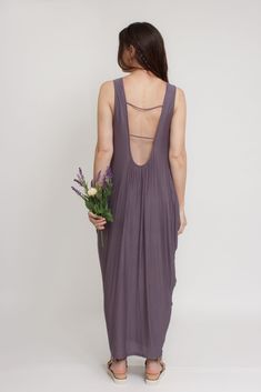 Brand: Mod Ref Open back maxi dress with exaggerated draping on both sides. ♡ Details Color: Purple Draping sides, slightly tapered towards bottom Open back Lined 96% Rayon, 4% Spandex Hand wash Sizing Model Info: Height 5'3"| Bust 32"| Waist 25"| Hips 34" Model is wearing a size medium Fit: Relaxed fit Stretch: More stretch MEASUREMENTS: S: Bust = 33" | Length = 49.5" M: Bust = 35" | Length = 50" L: Bust = 37" | Length = 51"