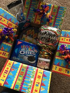 a birthday gift box filled with candy, candies and other items for a child's birthday