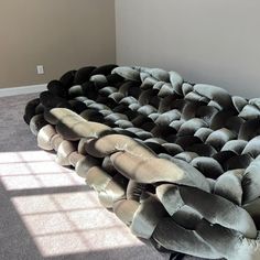 a couch made out of pillows in a room