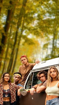 a group of people standing in front of a van