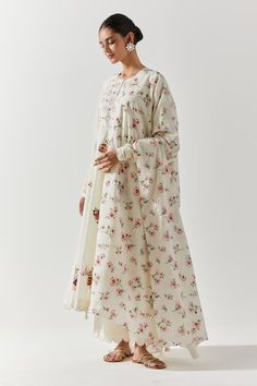 Ivory cotton mal anarkali with floral embroidery, mirror highlights. Paired with a scallop trimmed pant and dupatta with floral prints. - Aza Fashions Cotton Anarkali Set With Printed Motifs For Wedding, Spring Chanderi Anarkali Set With Mirror Work, Bollywood Style Cream Cotton Anarkali Set, Cream Cotton Anarkali Set With Straight Kurta, White Anarkali Set With Printed Motifs For Spring, Spring White Anarkali Set With Printed Motifs, Spring Cotton Salwar Kameez With Mirror Work, Cream Cotton Anarkali Set For Festivals, Spring White Anarkali Salwar Kameez