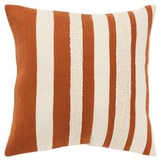 a brown and white striped pillow on a white background