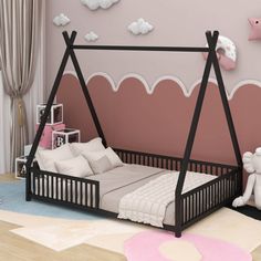 a child's bedroom with pink walls and white furniture, including a swing bed