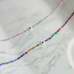 Rainbow Necklaces With Heart-shaped Beads, Rainbow Heart Beads For Jewelry Making, Rainbow Heart Beads Necklace, Multicolor Beaded Necklaces With Heart Charm, Multicolor Heart Shaped Tiny Beads Jewelry, Rainbow Heart-shaped Beads, Rainbow Heart Shaped Beads, Multicolor Beaded Necklace With Heart Charm, Rainbow Beaded Necklace With Heart Beads