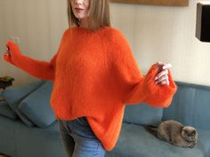 "An oversized sweater will fit sizes S-L Consisting of: 67% superkid mohair 3% wool 30% pa Color may appear slightly different on your computer monitor -One size: width - 130-134 сm/51.18\"-52.7\", Length - 60 cm/23.6\" Bright and stylish sweater made of high-quality Italian yarn. This soft body-friendly sweater will be relevant in autumn and spring, because it warms well, despite its weightlessness This round-neck sweater model looks very feminine. It has a loose fit that allows you to tuck it into jeans or wear it as an oversized pullover. The pleasant orange color will highlight your brightness and uniqueness, making your everyday life more colorful. CARE: Hand wash in cold water at 30-32C (86-89,6F) ONLY with a special detergent for wool and silk. Then spread out to dry on a horizontal Soft Mohair Sweater For Winter, Mohair Long Sleeve Sweater For Fall, Oversized Mohair Sweater With Soft Texture, Cozy Mohair Sweater For Fall, Fall Mohair Crew Neck Top, Winter Mohair Knitted Tops, Winter Soft Knit Mohair Tops, Cozy Winter Mohair Tops, Casual Long Sleeve Mohair Sweater