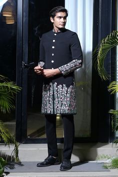 Black sherwani with floral thread, sequin, cutdana and applique embroidery. Paired with a pant. - Aza Fashions Festive Designer Sherwani With Floral Embroidery, Designer Transitional Sherwani With Floral Embroidery, Designer Sherwani With Floral Embroidery For Eid, Designer Black Bandhgala With Floral Embroidery, Black Bandhgala With Floral Embroidery For Designer Wear, Formal Sherwani With Floral Embroidery For Diwali, Designer Traditional Wear With Floral Embroidery For Ceremonial Events, Traditional Black Sherwani With Floral Embroidery, Designer Ceremonial Traditional Wear With Floral Embroidery