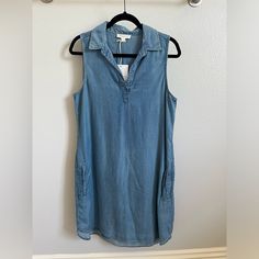 Sleeveless Denim Dress With Pockets Sleeveless Washed Blue Denim Dress For Spring, Casual Sleeveless Medium Wash Denim Dress, Casual Blue Sleeveless Dress, Sleeveless Medium Wash Denim Dress, Casual Sleeveless Denim Blue Dress, Casual Blue Denim Sleeveless Dress, Spring Sleeveless Light Wash Denim Dress, Medium Wash Sleeveless Cotton Dress, Sleeveless Cotton Dress In Medium Wash