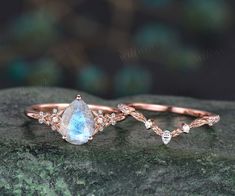 three different types of wedding rings on top of a rock