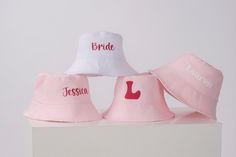 "Personalized Hats, Unisex Bucket Hats, Wide Brim Hats, Custom Outdoor Summer Cap, Best Bucket Hats, Pink Bucket Hats, Personalized Gift Hats, Personalized Bucket Hat Gift Custom Pink Bucket for bridesmaids gift or wedding favor. Floppy Beach Hat Personalized Bride Hat Floppy Hat with Name Custom Personalized Beach Hat Unisex Fisherman hat Honeymoon Must Have Honeymoon Gifts. Bridal shower gift. Our made of honor gift hats are specially made for your name or anything you want. Amazing aesthetic Customizable Bucket Hat, One Size Fits Most, Customizable Bucket Hat One Size Fits Most, Customizable Bucket Hat One Size, Cotton Bucket Hat For Gift, Cotton Bucket Hat Gift, Customizable One Size Bucket Hat, Personalized Adjustable Bucket Hat, Customizable Bucket Hat, Adjustable Bucket Hat With Letter Print