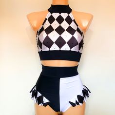 a female mannequin wearing a black and white checkered top