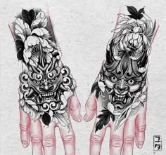 two hands that have tattoos on them and some flowers in the middle of each hand