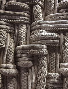 many ropes are stacked together to form a wall