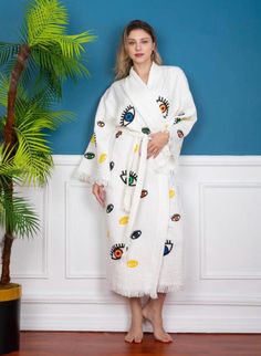 This organic cotton robe is super soft and comfortable. Hand printed with wooden block printing technique. One Size Fits Most White Long Sleeve Relaxed Fit Kimono, White Cotton Kimono With Relaxed Fit, White Cotton Relaxed Fit Robe, White Cotton Sleepwear For Vacation, White Relaxed Fit Kimono For Loungewear, White Oversized Spring Robe, Oversized White Spring Robe, White Oversized Robe For Spring, White Long Sleeve Relaxation Robe