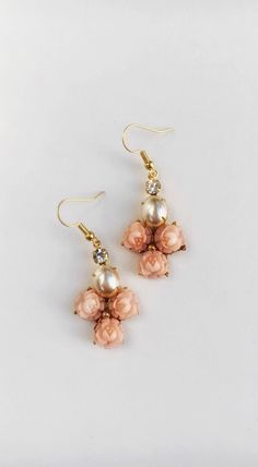 Bridal earrings.  Dusty pink carved roses and pearl vintage assemblage.  Beautiful for a bride to we Rose Detail Jewelry For Wedding, Pink Rose Design Jewelry For Wedding, Rose Gold Rose Detail Wedding Earrings, Rose Dangle Flower Earrings For Wedding, Handmade Rose Earrings For Wedding, Feminine Rose Design Jewelry For Wedding, Rose Colored Dangle Flower Earrings For Wedding, Elegant Wedding Jewelry With Rose Detail, Rose Dangle Earrings For Wedding