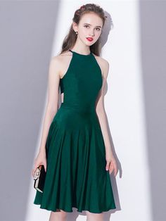 Green Halter Knee-Length Homecoming Dress Green Stretch Halter Neck Dress, Fitted Green Backless Dress For Prom, Backless Stretch Midi Dress For Prom, Green Sleeveless Backless Stretch Dress, Stretch Backless Midi Dress For Prom, Green Sleeveless Stretch Backless Dress, Green Stretch Halter Backless Dress, Fitted Green Backless Maxi Dress, Green Stretch Halter Dress For Evening