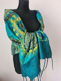 Large blue green felted scarf made of natural materials.A unique handmade gift for a birthday. This is an author's scarf for lovers of unique things and clothes. The scarf is made of delicate merino wool and natural silk, which is hand-painted. Mandalas are painted on the scarf, which mystically attract our attention. Such a scarf can be worn in any season and with any clothes, it can be jeans and a jacket or an evening dress. The size of the scarf is 210 cm / 83 inches long and 56 cm/ 22 inch w Green Handmade Shawl As Gift, Handmade Green Shawl For Gift, Handmade Green Shawl For Winter, Handmade Green Scarf For Winter, Green Shawl Scarf As A Gift, Green Scarves For Winter Gifts, Handmade Green Winter Scarves, Handmade Green Winter Scarf, Green Winter Scarves For Gifts