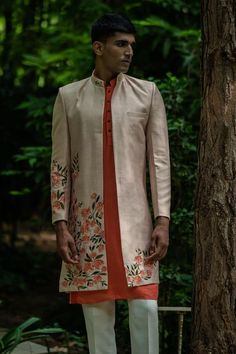 Beige longline jacket with floral embroidery. Comes with peach kurta and pyjama. - Aza Fashions Spring Straight Kurta With Zari Work, Unstitched Chikankari Embroidery Nehru Jacket For Spring, Spring Zari Work Straight Kurta, Designer Sherwani For Spring, Designer Bandhgala For Spring With Long Sleeves, Fitted Nehru Jacket With Embroidered Sleeves, Spring Outerwear With Resham Embroidery In Straight Kurta Style, Traditional Fitted Outerwear With Embroidered Sleeves, Embroidered Traditional Wear For A Spring Wedding